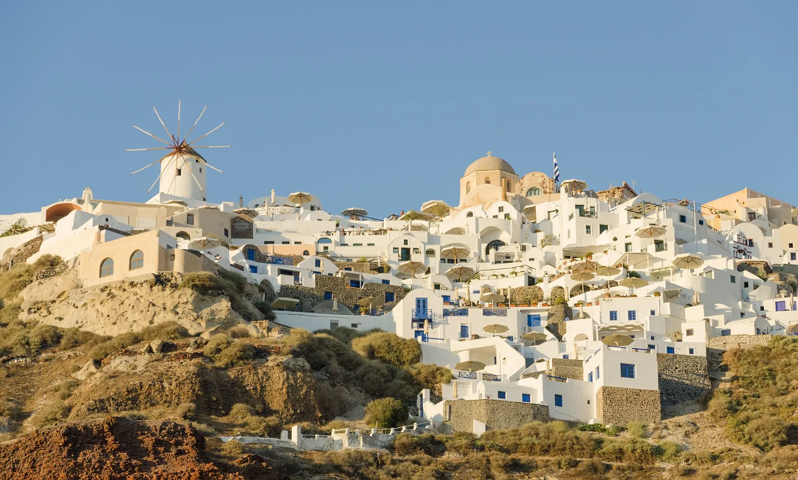 The whitewashed village of Oia in Santorini above the Aegean Sea